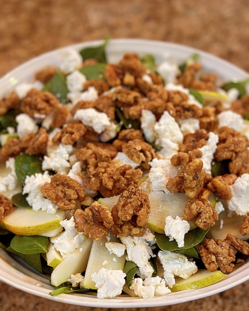 Spinach salad with pears, candied walnuts and goat cheese